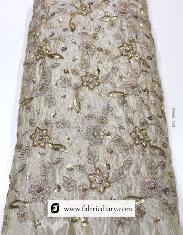 Dyeable floral embroidered fabric on gold tissue