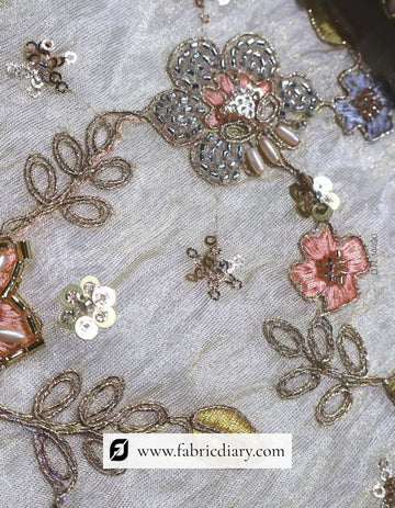 Multicolor floral fabric on gold tissue for gowns