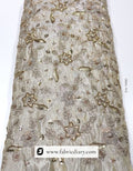 Dyeable floral embroidered fabric on gold tissue