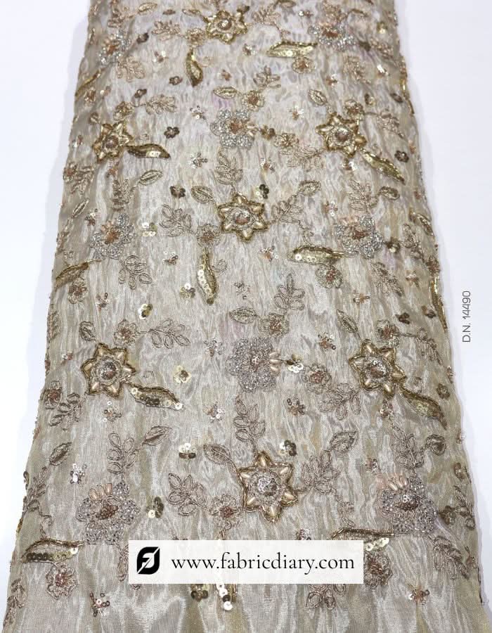 Dyeable floral embroidered fabric on gold tissue