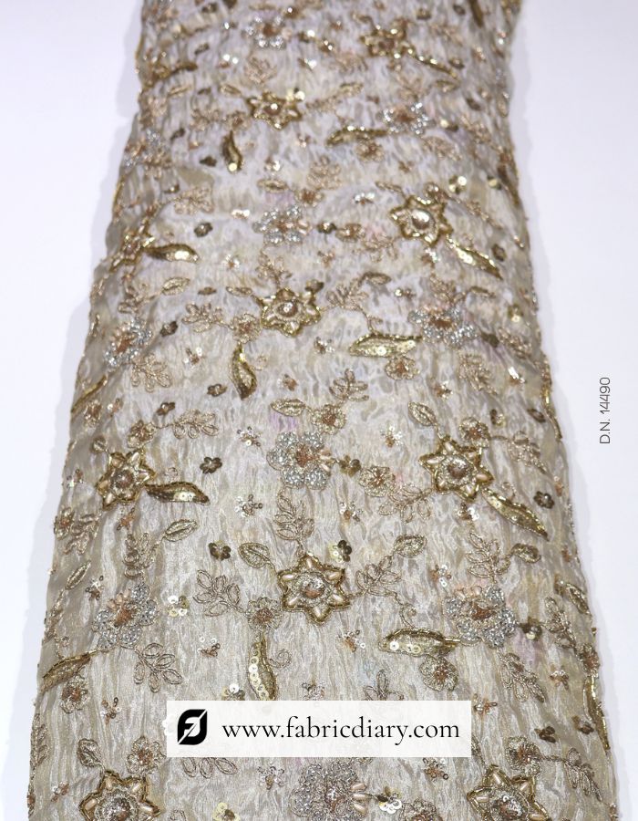 Dyeable floral embroidered fabric on gold tissue