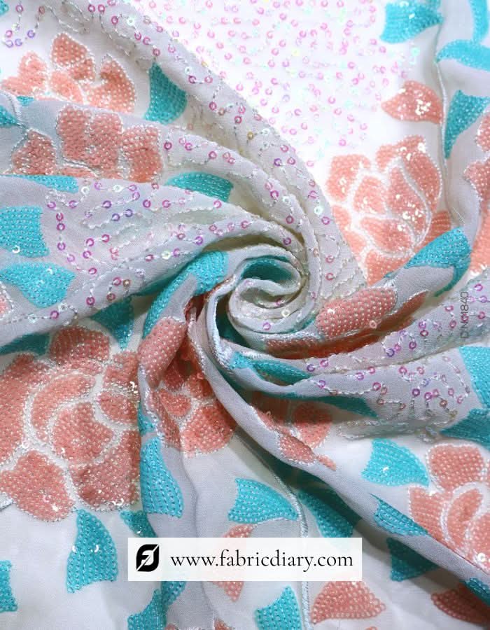 Daman border embroidered fabric – buy peach & blue sequins material online