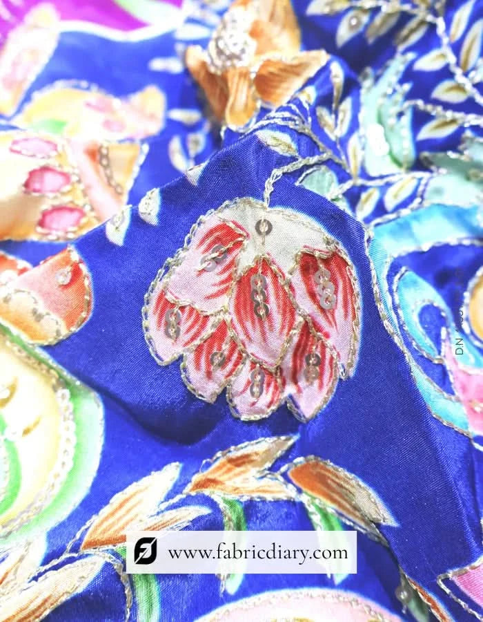 Premium floral position print fabric folded on studio table